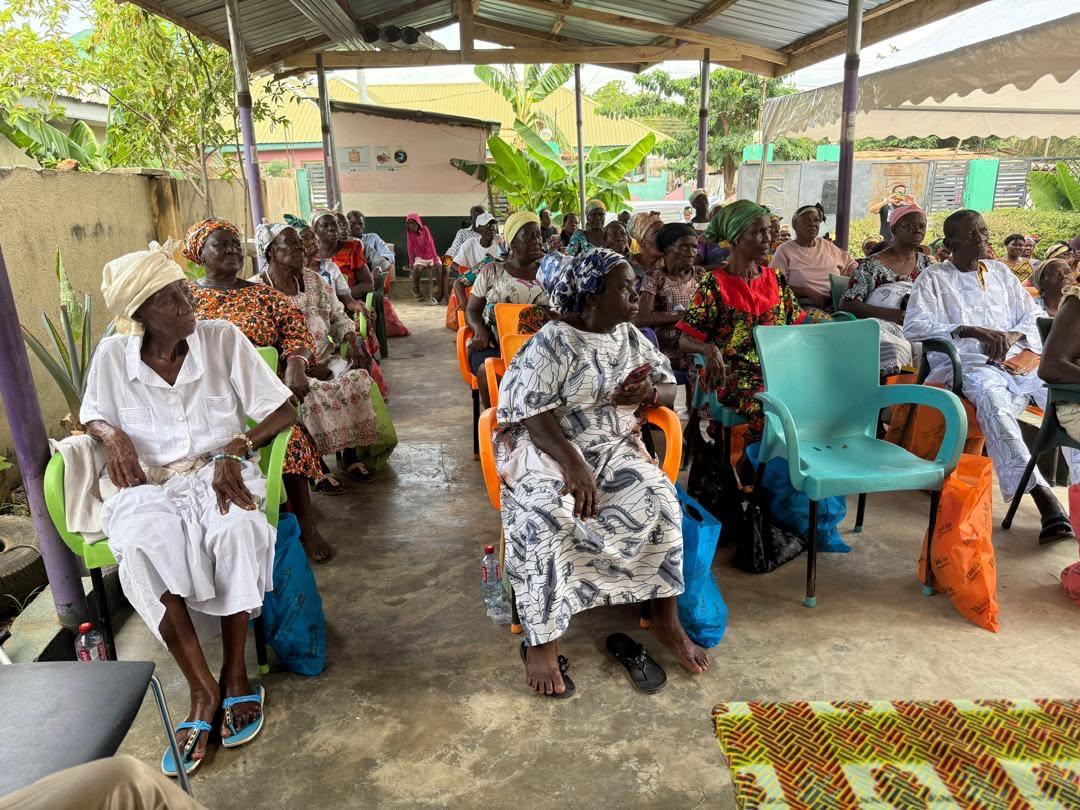 Care team supporting an elderly patient